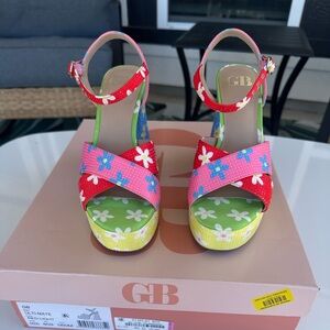 FLOWER POWER…..GB platform heels size 6 and like new! Bright multi-colored.